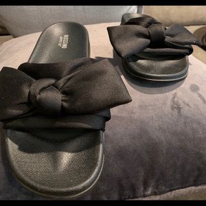 Black bow tie flip flops